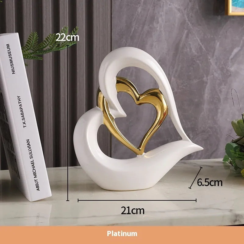 Modern white porcelain love heart ornament with a choice of metallic gold, silver and coloured finishes.