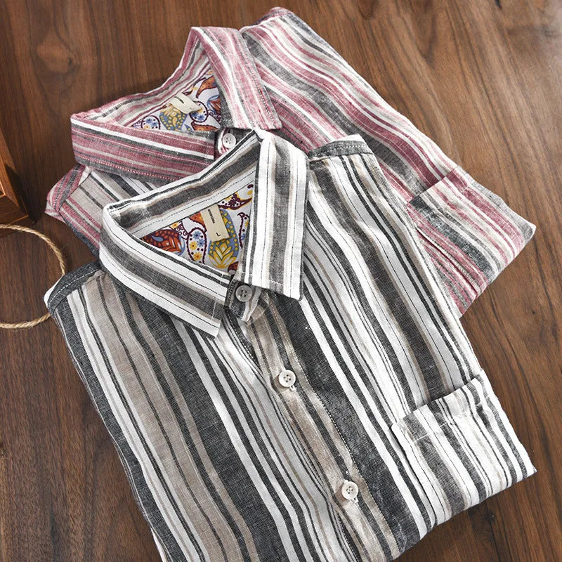 Man wearing a loose-fit red and grey striped linen long-sleeve casual shirt.
