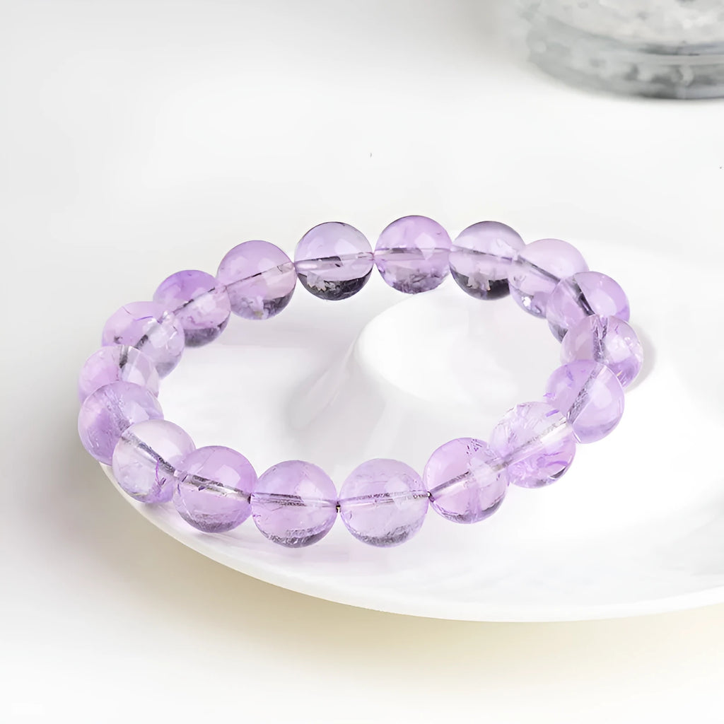 Lavender amethyst crystal bracelet with round beads showing water ripple design in light purple colour