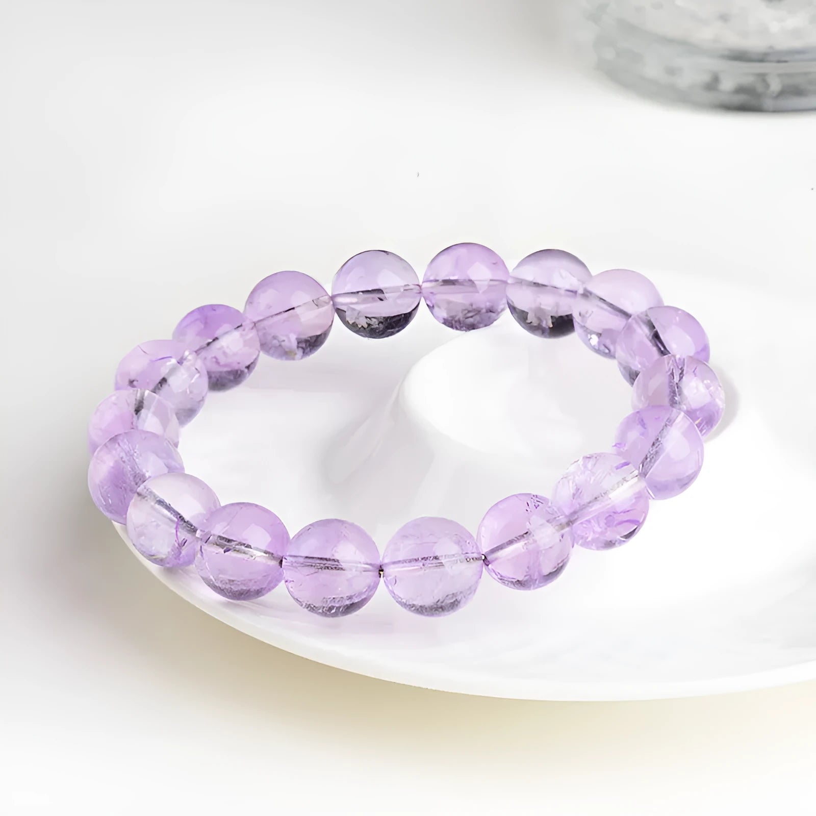 Lavender amethyst crystal bracelet with round beads showing water ripple design in light purple colour