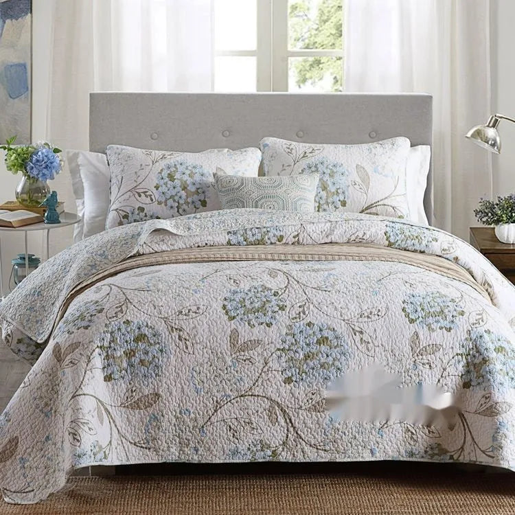 Quilted cotton bed cover set with printed pattern including bedspread and two pillowcases