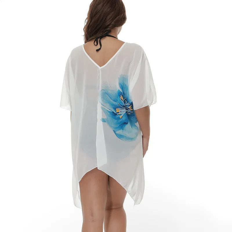 White loose-fitting plus-size beach cover-up blouse for women.