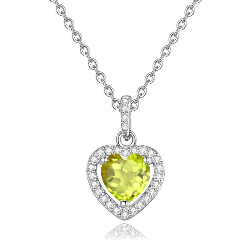 Women's sterling silver necklace with a heart-shaped amethyst pendant on an adjustable cross chain.