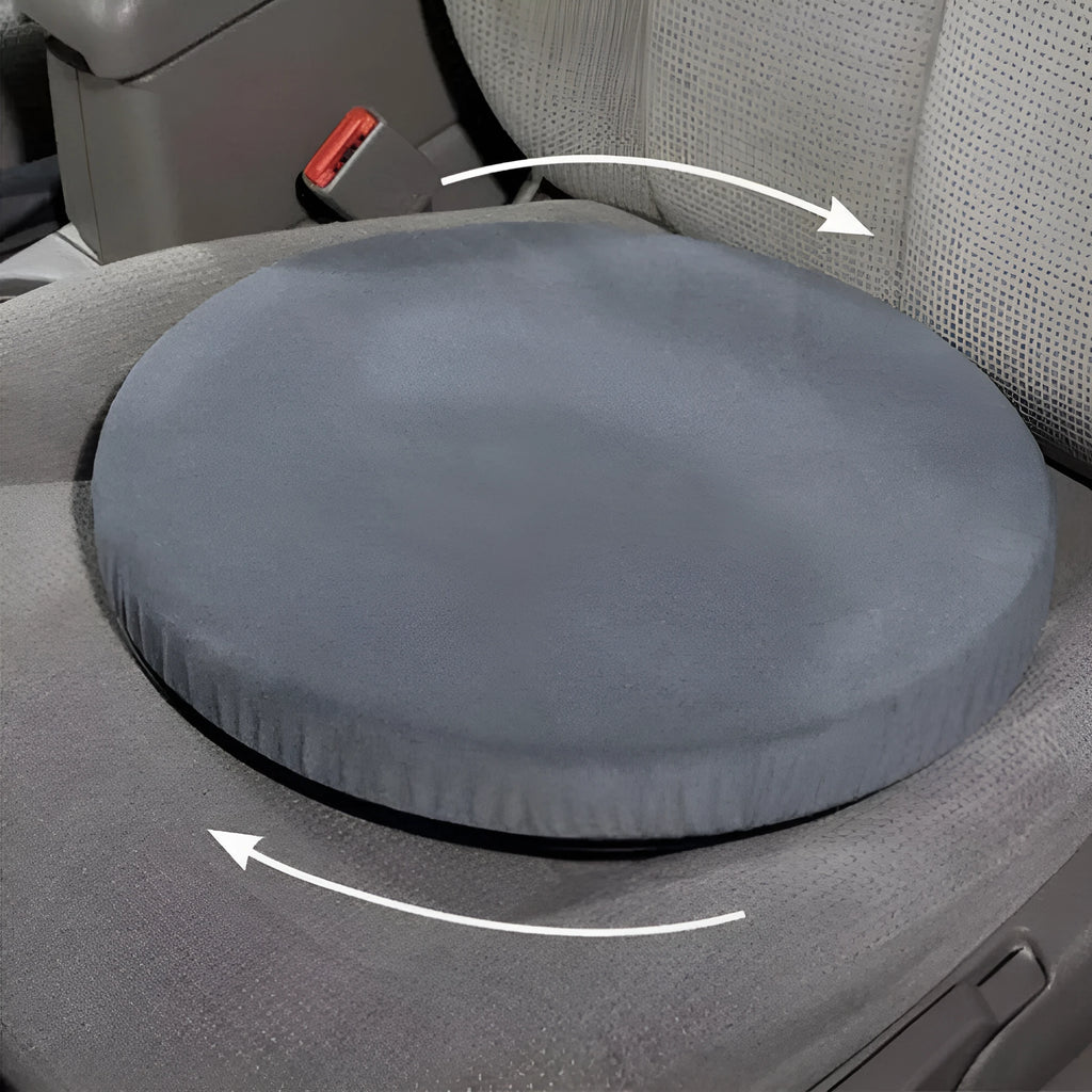 Round grey car seat cushion with a rotating base, shown on a car seat.