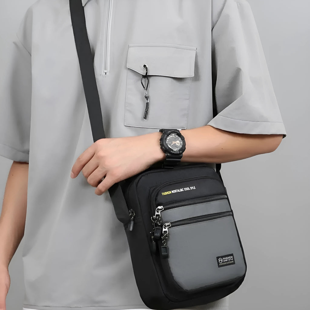 Men's nylon crossbody bag in green, shown with multiple pockets and adjustable shoulder strap.