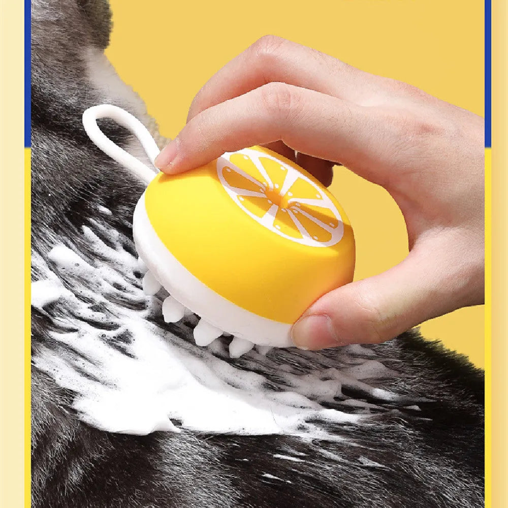 Yellow silicone pet bath brush with massage nodes and comb teeth for dog and cat grooming during washing
