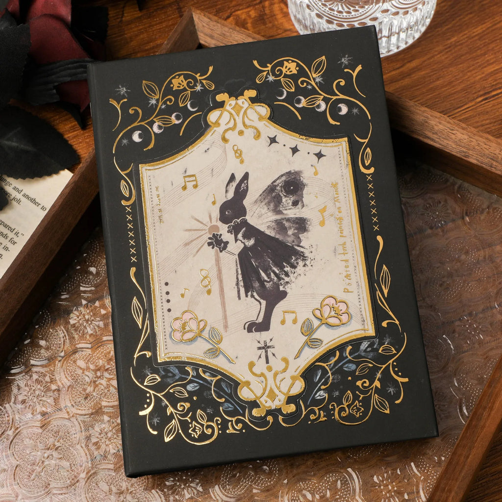 Retro gothic style A5 notebook open on a table, showing detailed cover art and wood pulp paper pages.