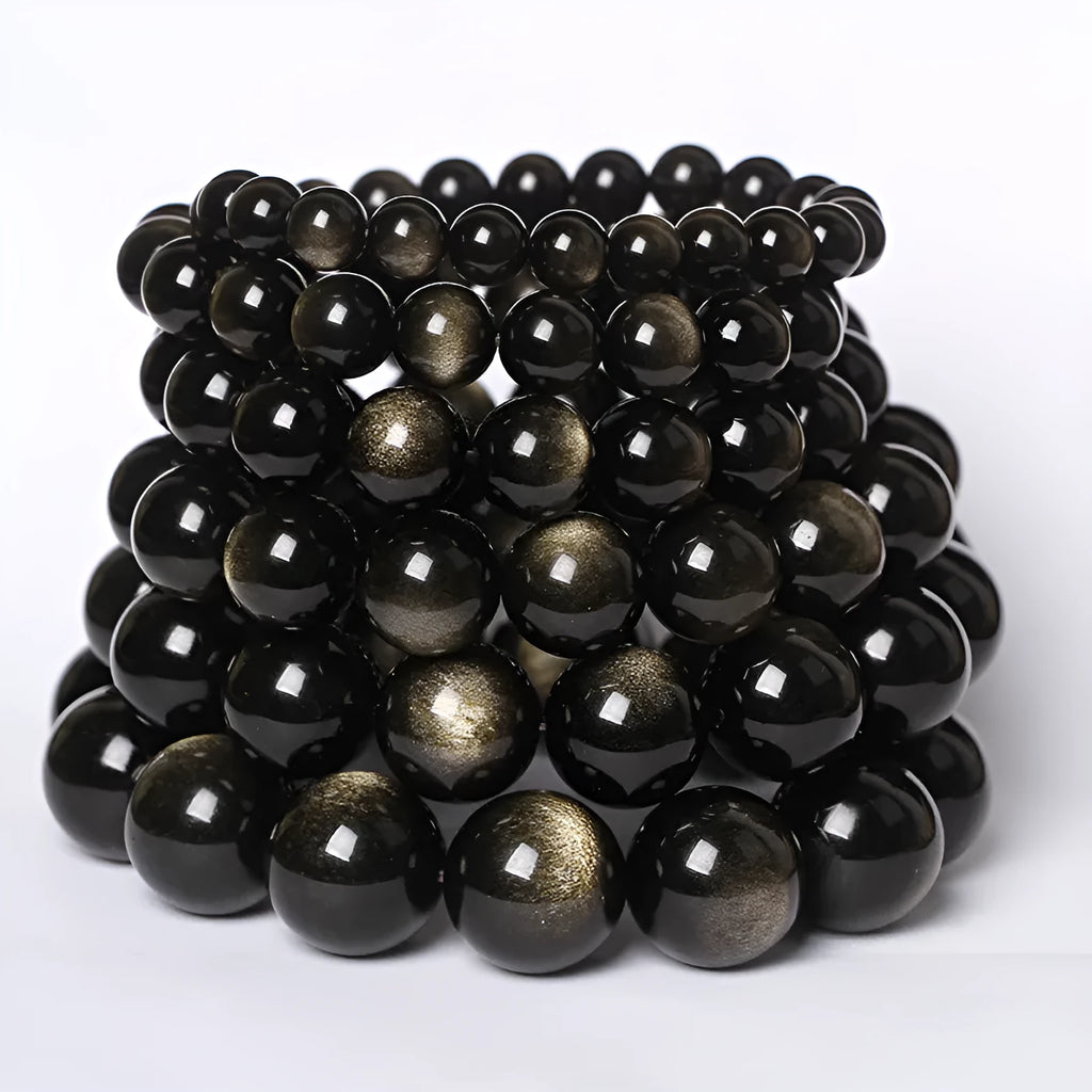 Hand-woven round obsidian crystal bracelet in ethnic style on a wrist, showing colour and bead size options.