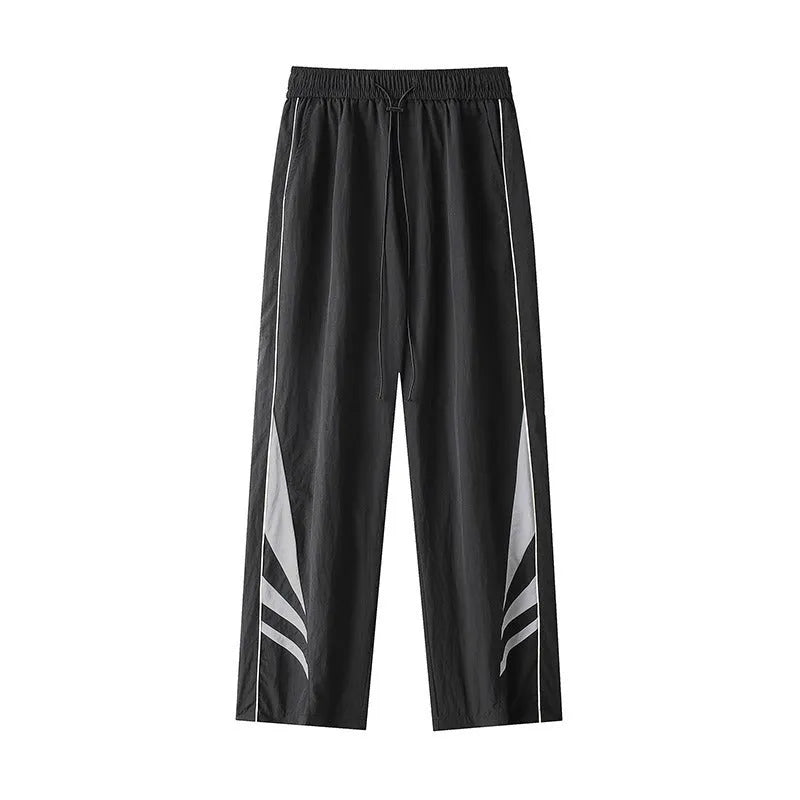 Men's straight-leg loose fit summer sports trousers in grey, showing button fly and elastic waistband.