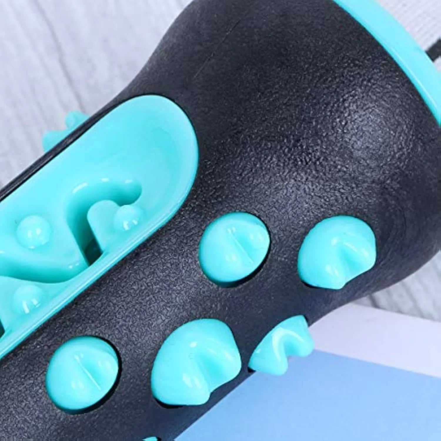 Natural rubber dog toothbrush chew toy in blue, showing textured surface for dental cleaning