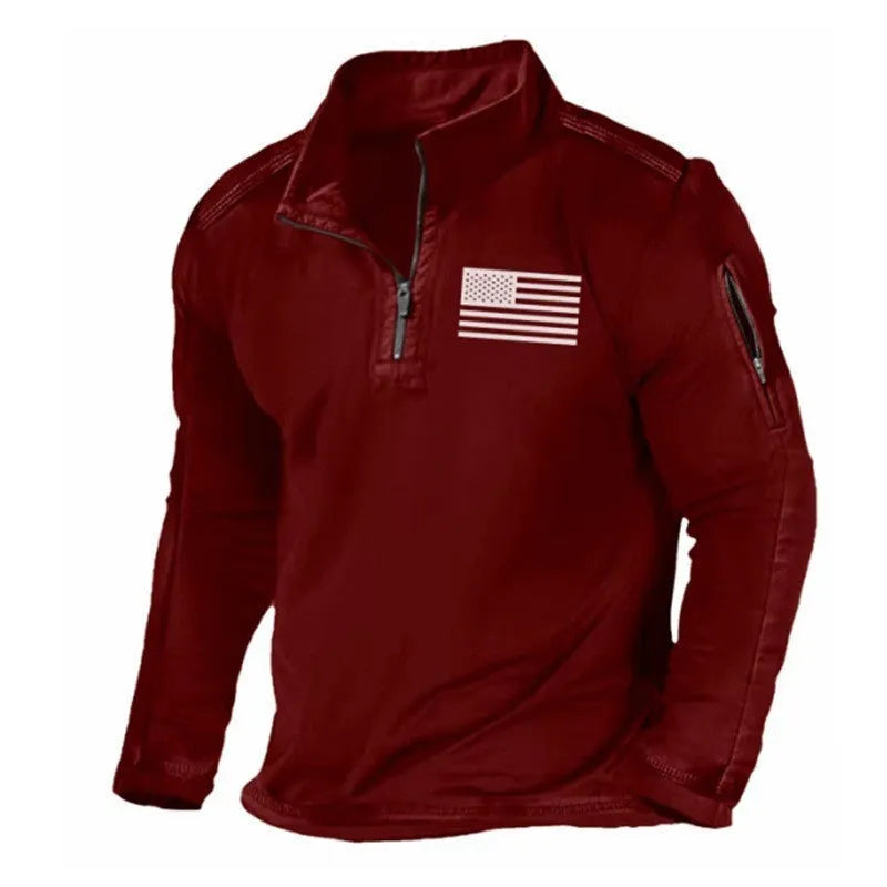Men's dark coloured zip-up sweater with a stand collar and long sleeves laid flat.