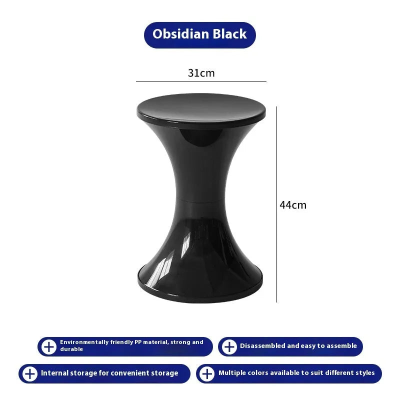 Hourglass-shaped plastic shoe changing stool in green, shown as a step aid.