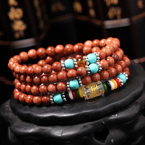 Golden star stone colour bracelet with 108 nugget sand pieces and six words mantra design