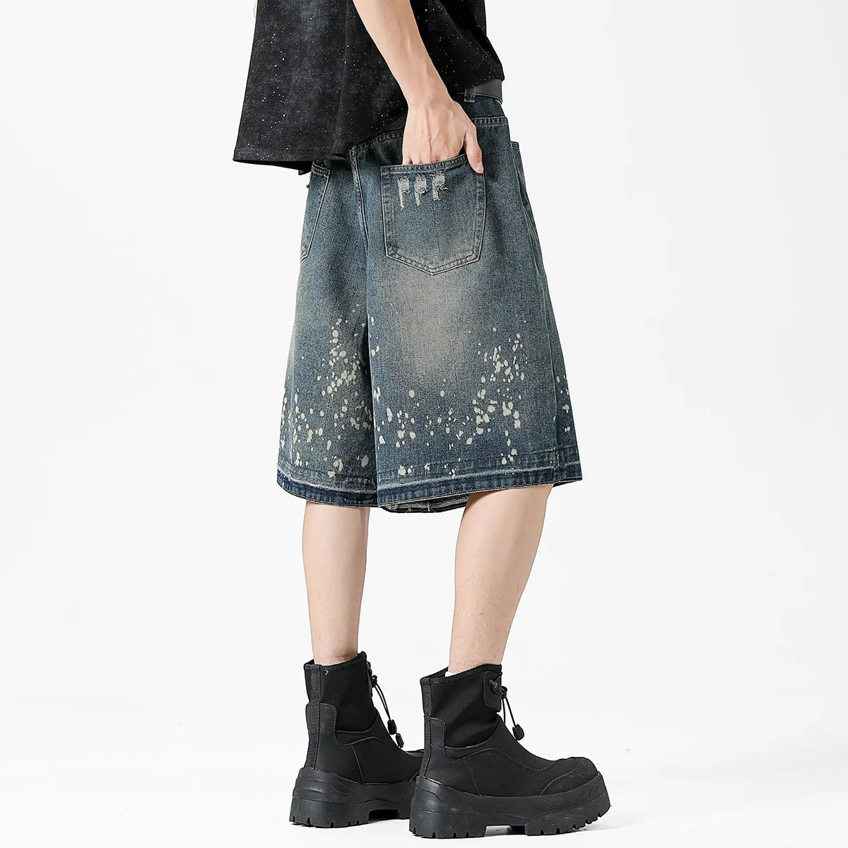 Men's retro blue denim shorts with ripped splash ink pattern and straight cut design
