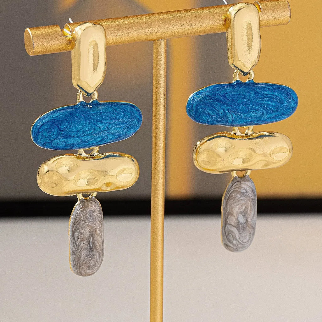 Geometric multicolor stud earrings for women with electroplated finish and simple design.