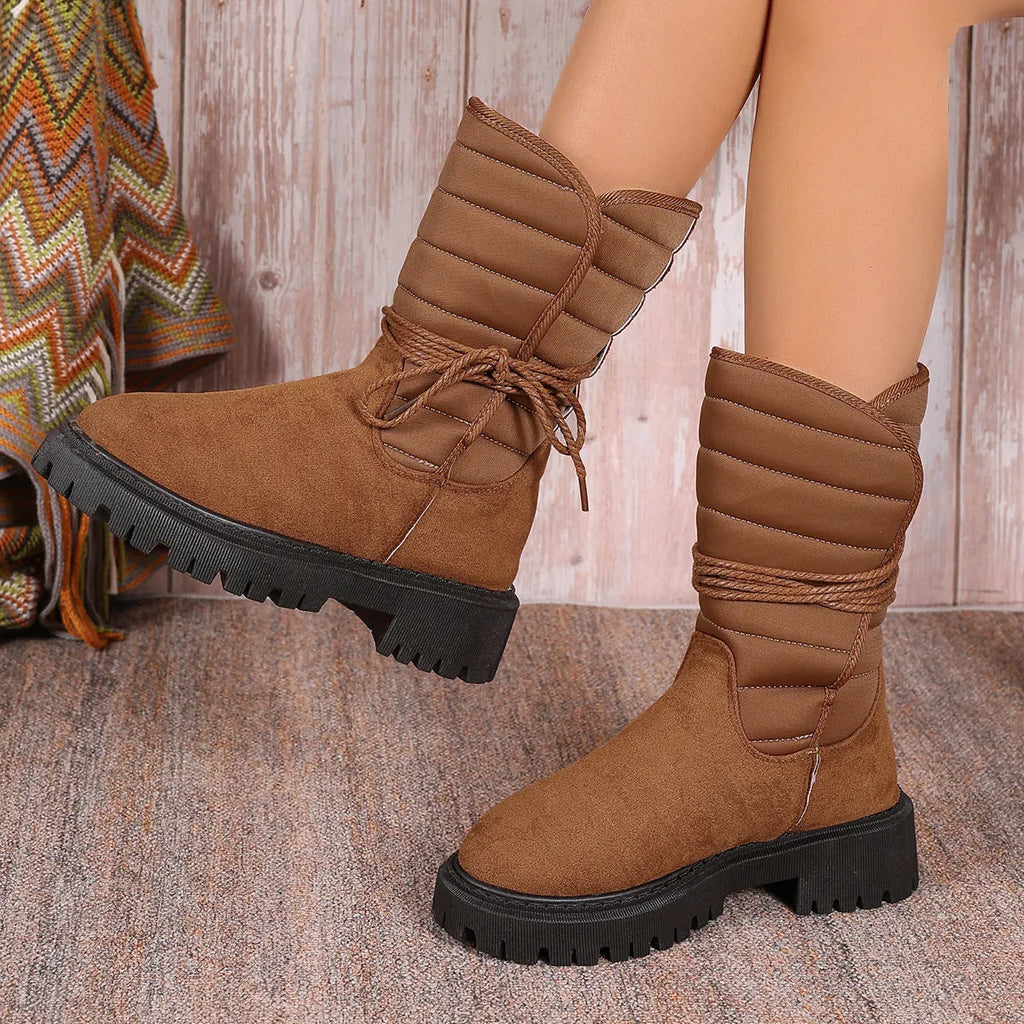 Women's chunky heel snow boots in black with suede upper and lace-up design