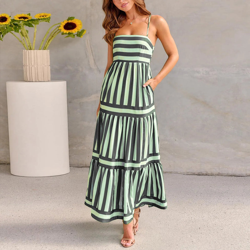 Women's printed long dress with suspender straps, square neckline, side pockets, and backless design