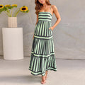 Women's printed long dress with suspender straps, square neckline, side pockets, and backless design