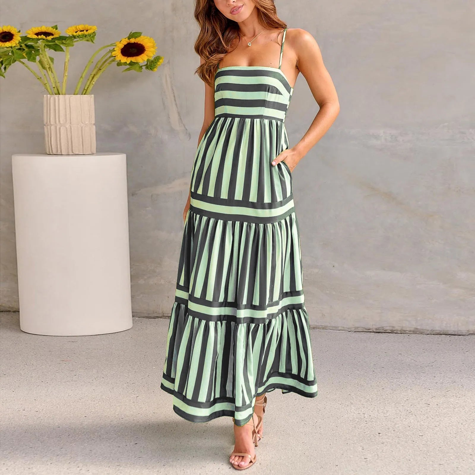 Women's printed long dress with suspender straps, square neckline, side pockets, and backless design