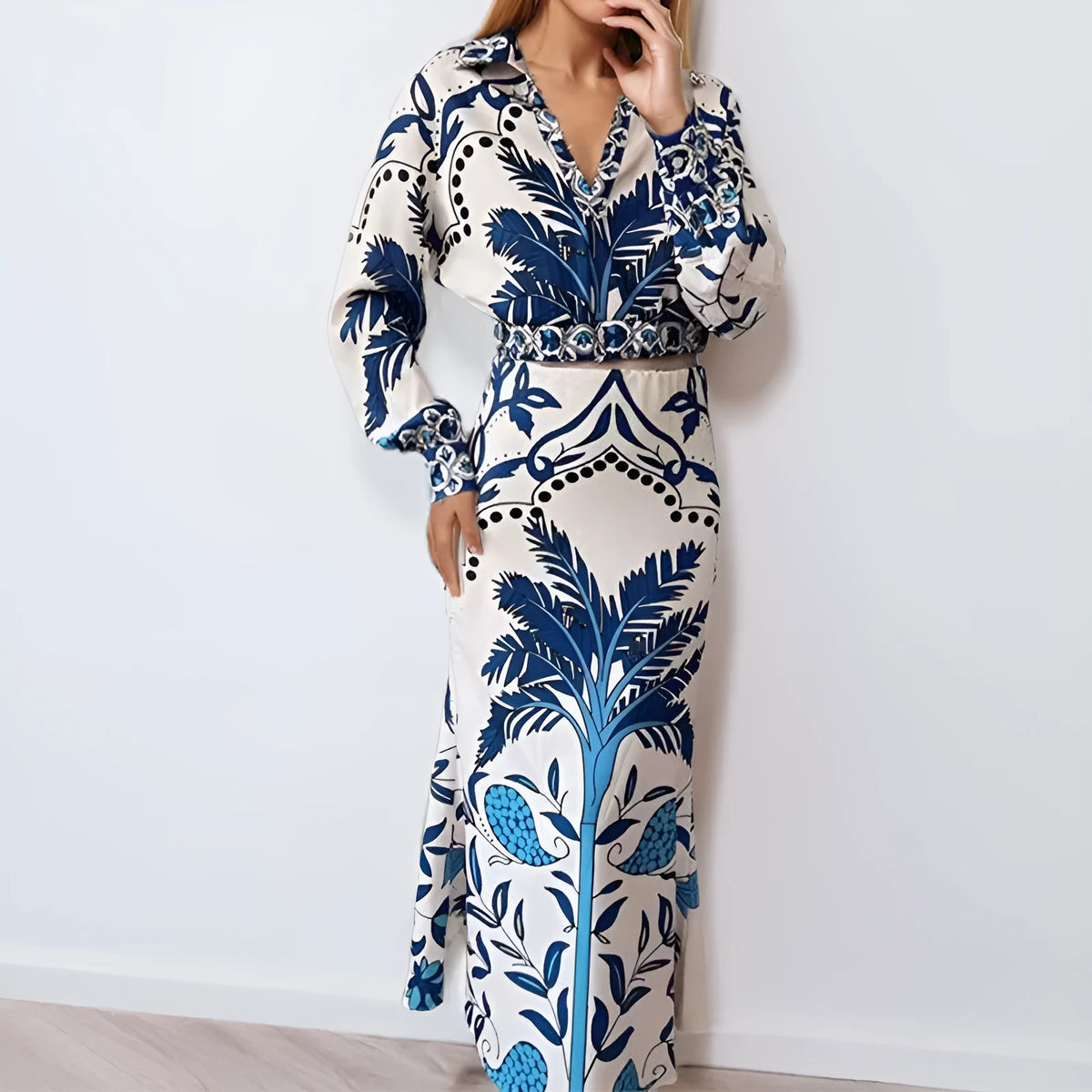 Women's casual floral print two-piece set with long sleeve top and long skirt on a hanger.