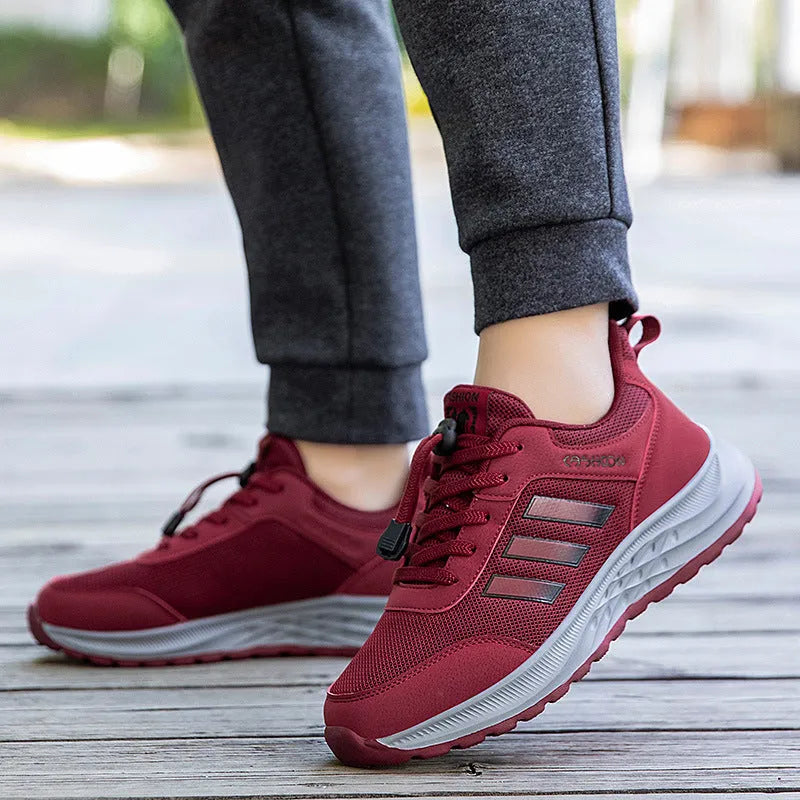 Breathable mesh elastic slip-on casual shoes for men and women in purple, black, and grey.