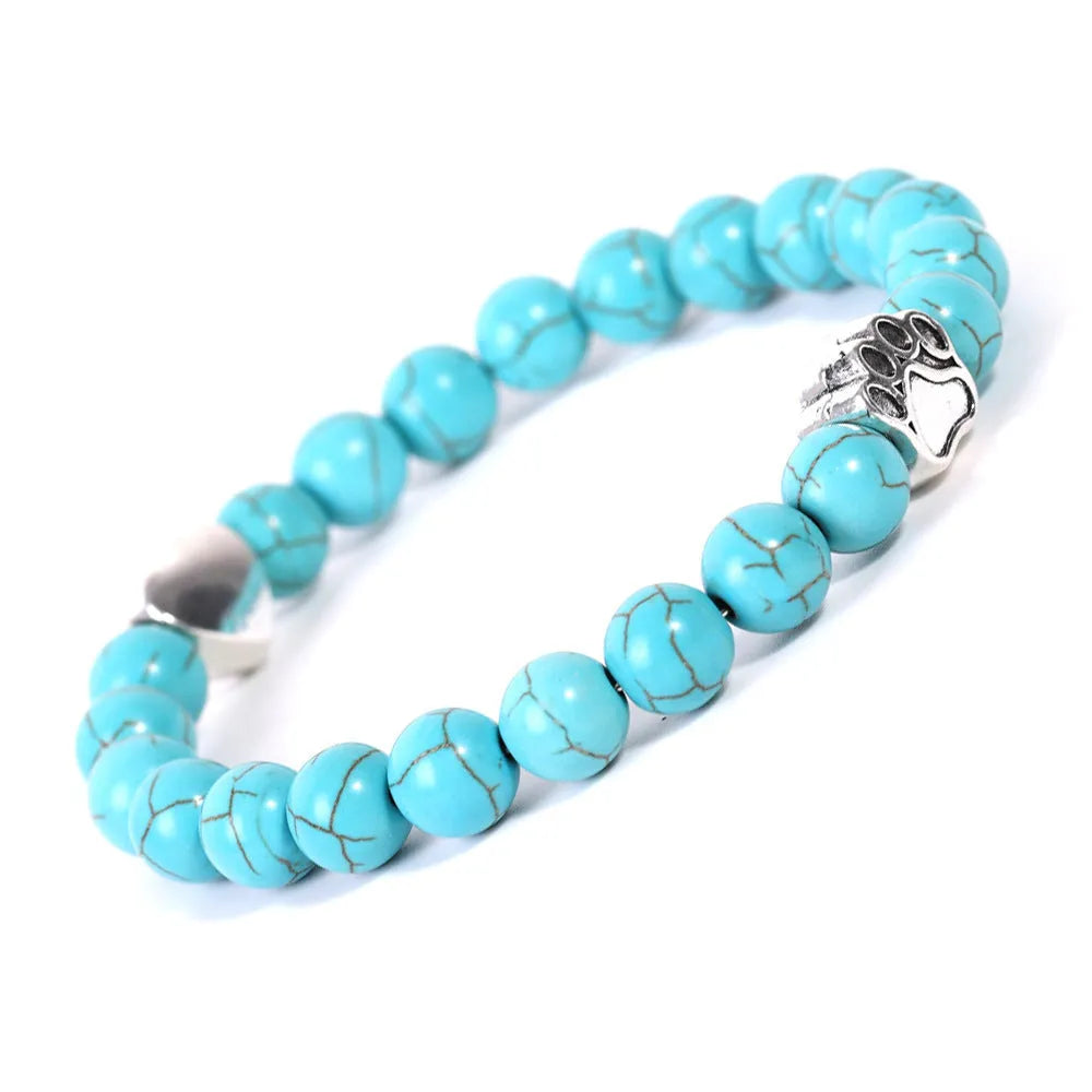 Tiger's Eye and Indian Agate stone beaded bracelet with a dog's paw charm on a white background.