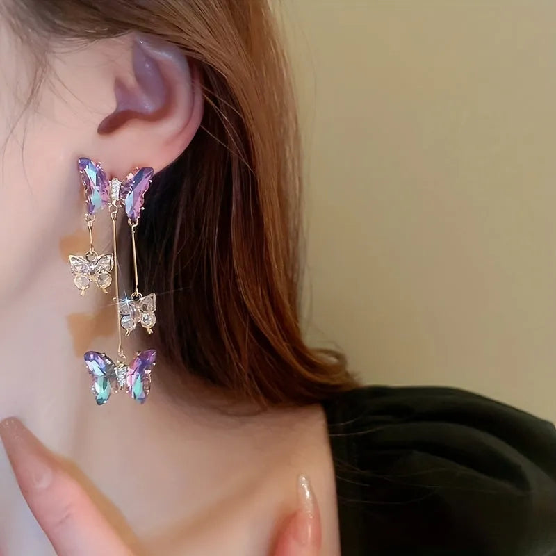 Silver needle crystal flowers butterfly tassel earrings in blue purple colour on alloy backing