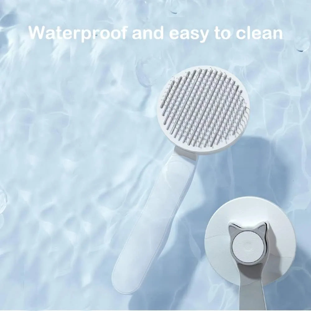 Self cleaning cat brush with blue rubber handle and metal pins with round tips
