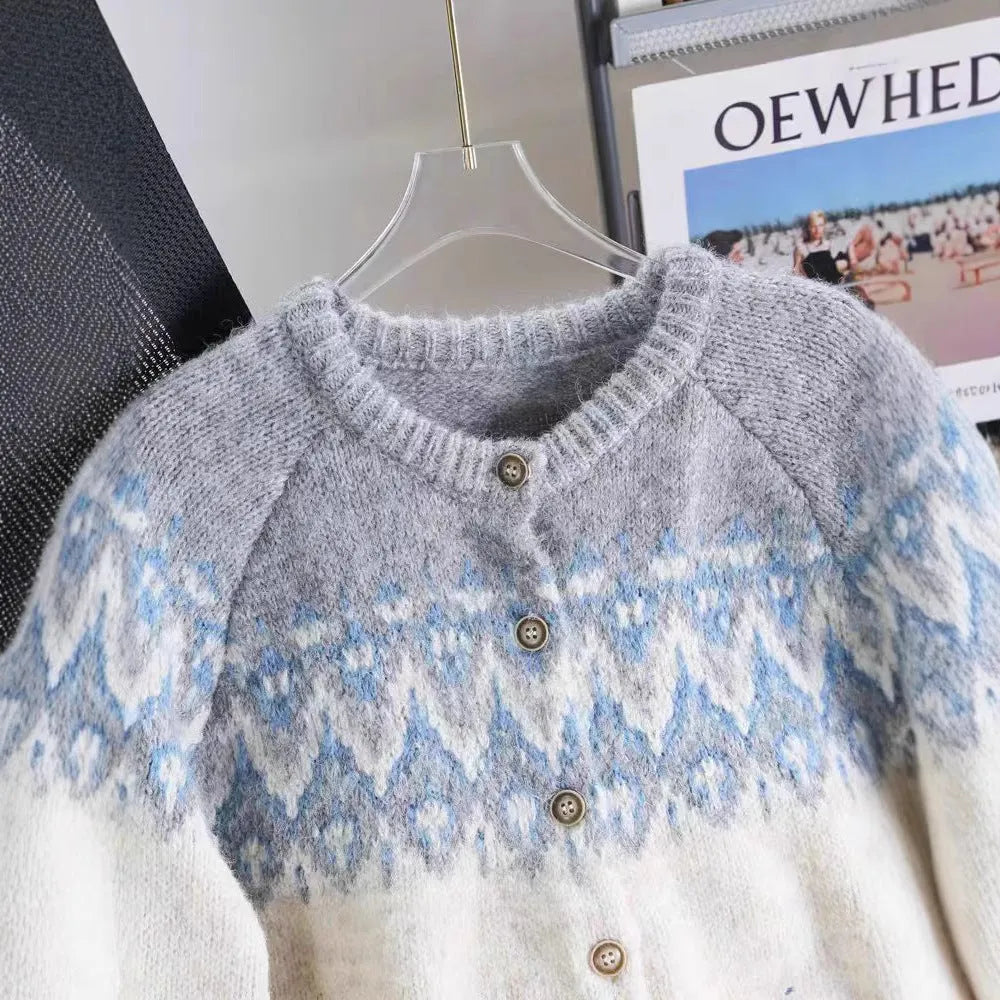 Women's loose fit jacquard knit sweater coat in milky white, shown on a hanger.