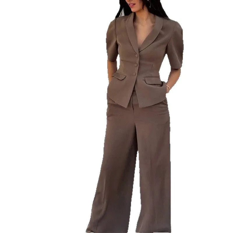 Brown polyester men's slim fit formal suit set with long sleeves and trousers on a hanger.