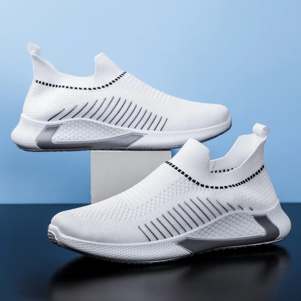 Men's black and white striped mesh slip-on sneakers with lace-up front on a white background