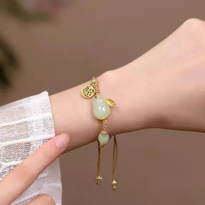 Hetian jade rabbit charm bracelet for women on a yellow string fastening