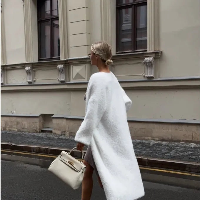 White thick knitted women's cardigan jacket with extended length and loose fit design