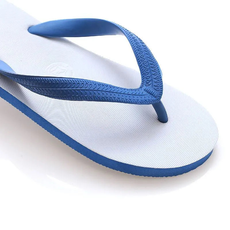 A pair of casual flip-flops with a rubber sole, shown in one of four colours (green, red, blue, or black) featuring a distinctive fish label graphic.