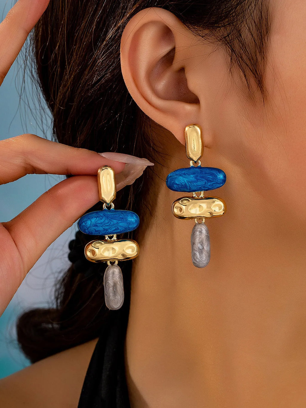 Geometric multicolor stud earrings for women with electroplated finish and simple design.