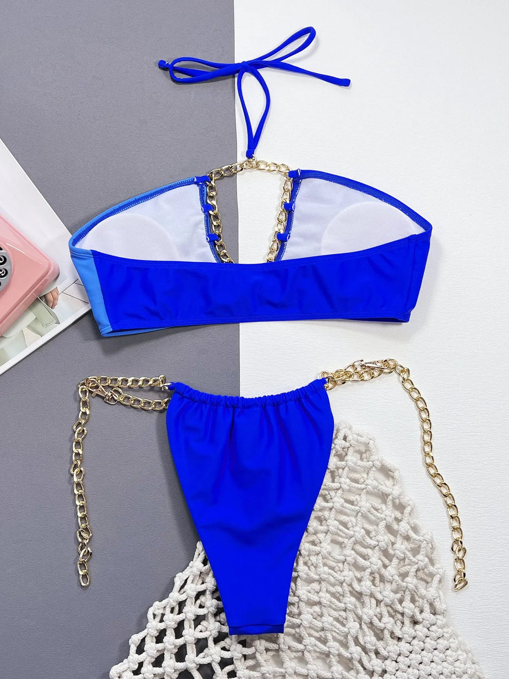 Blue solid colour women's nylon bikini swimsuit set on a white background.