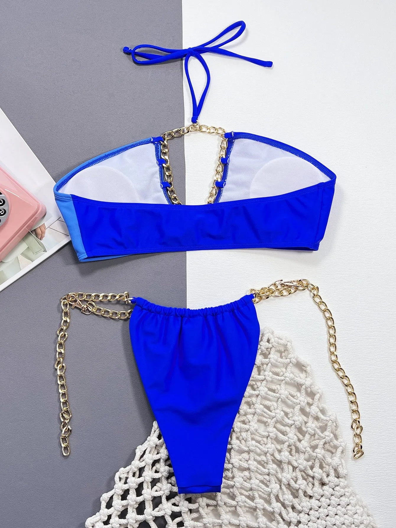 Blue solid colour women's nylon bikini swimsuit set on a white background.
