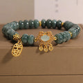 Natural emerald green jade abacus beads bracelet with a metallic alloy safety lock clasp.
