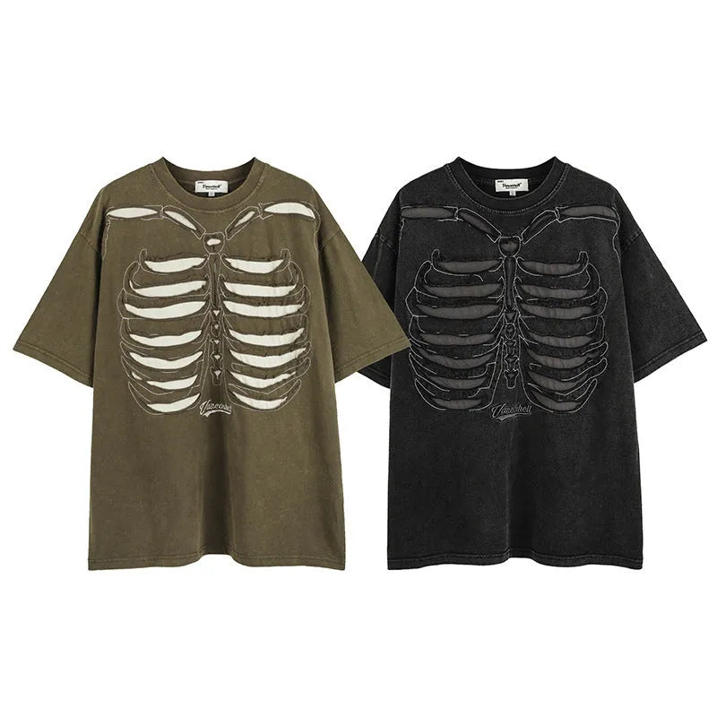 Man wearing a black loose-fit cotton T-shirt with a printed skull and letters graphic and drop-shoulder sleeves.