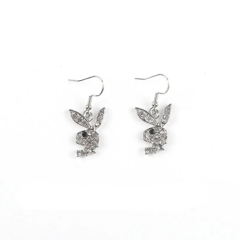 Close-up of alloy rabbit stud earrings with full diamond detail in silver, pink, or gold colour.