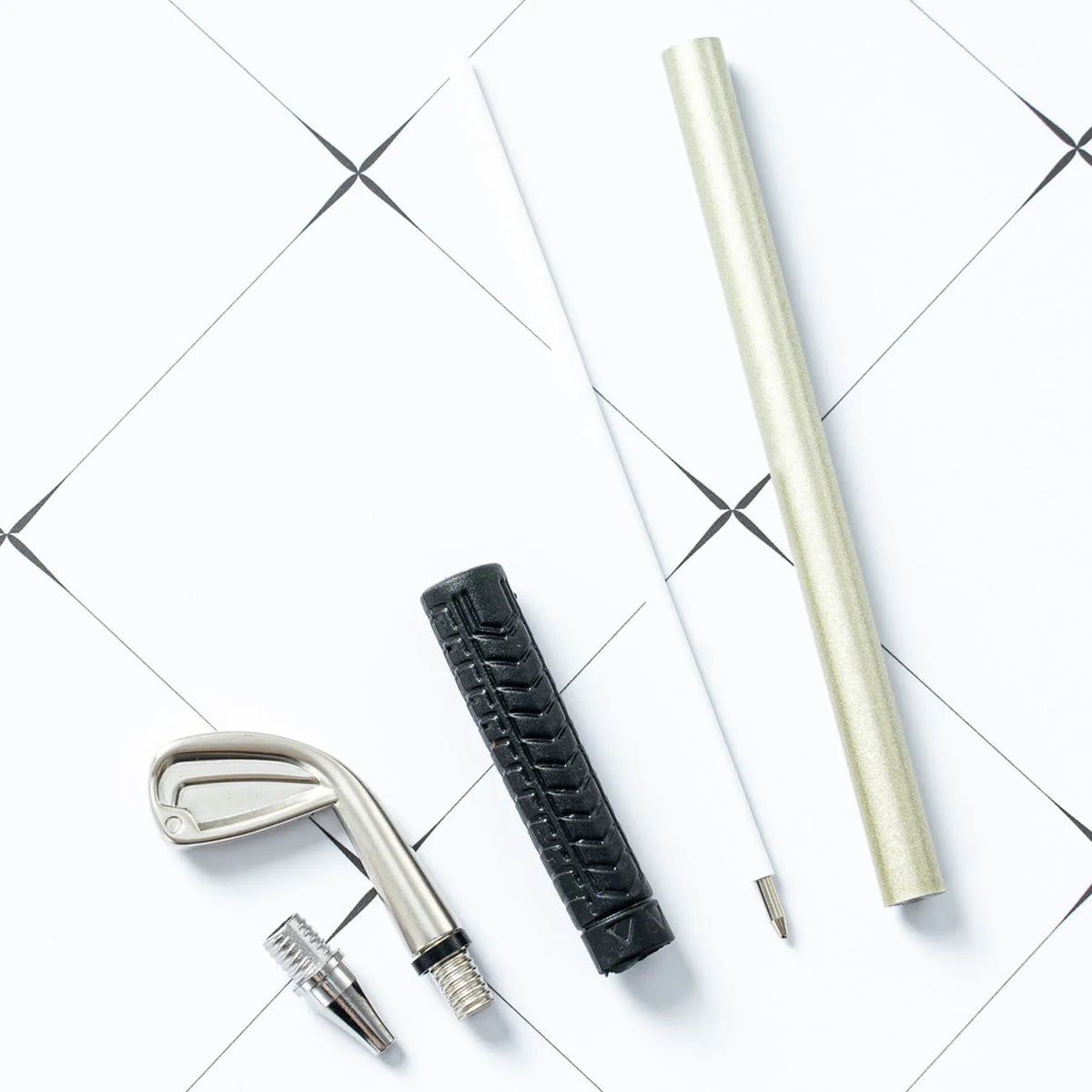 Three metal ballpoint pens with suit design in golf packaging, showing bullet-type 0.7mm pen heads
