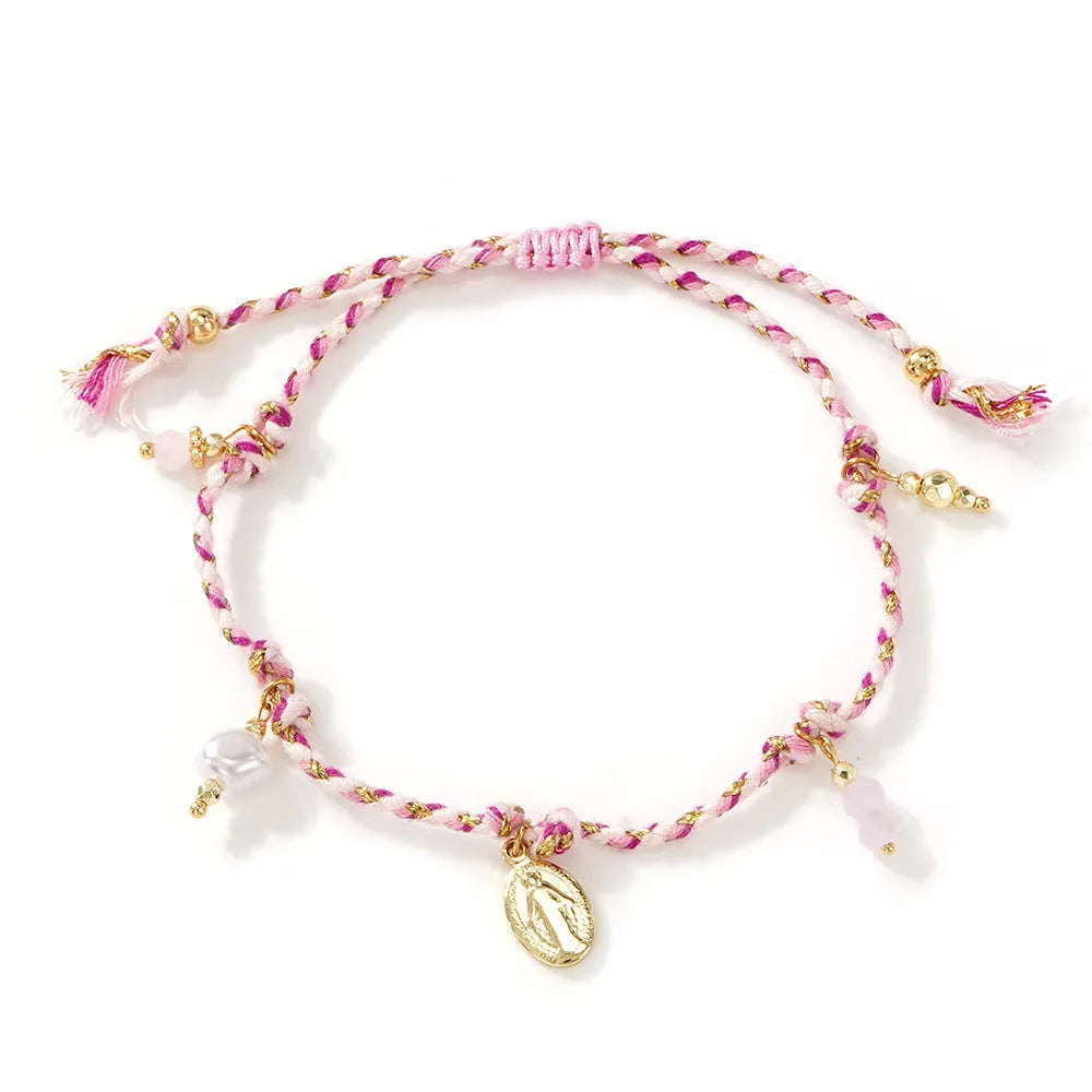 Close-up of a hand-woven colourful braided rope bracelet for women featuring an adjustable carrying strap tag closure.