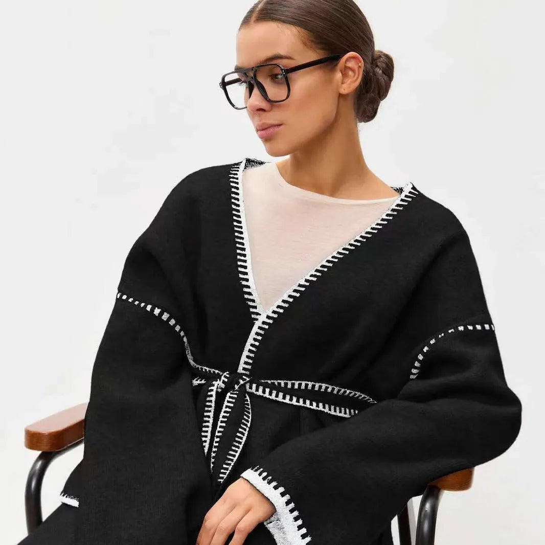 Loose fit knitted cardigan with lace-up front detail in thick imitation cashmere cotton fabric.