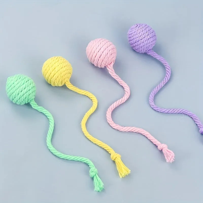 Green cat toy ball with a built-in rope and bell in a 6cm size.