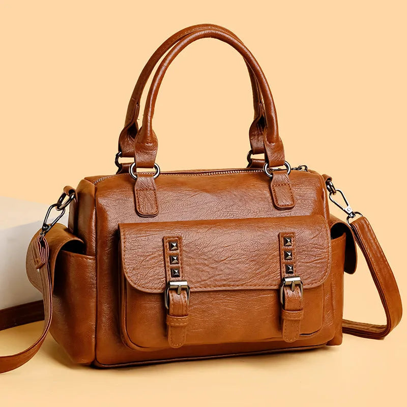 Vintage messenger bag in horizontal square shape with contrast stitching, shown in available colours