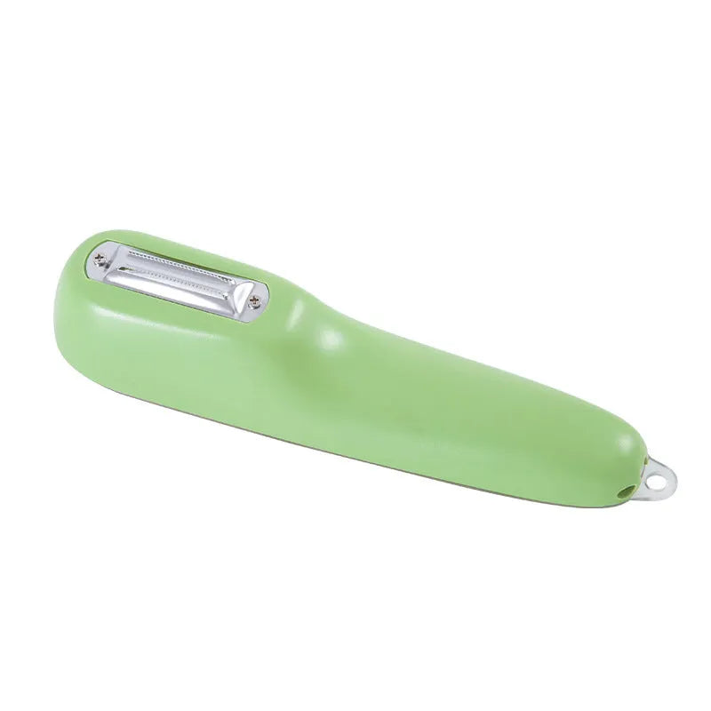 Dark green kitchen peeler with stainless steel blade stored inside its clear plastic storage tube.