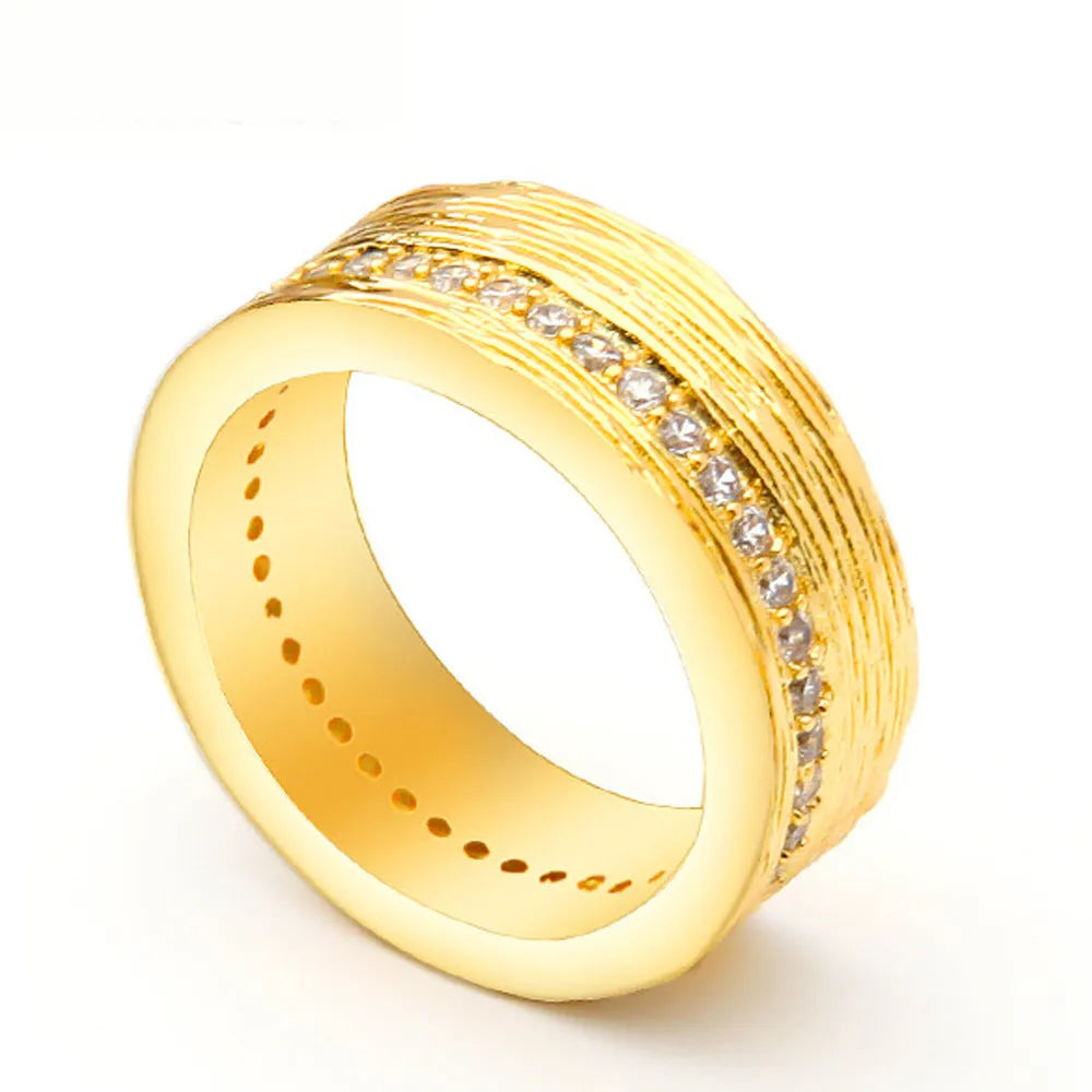 Geometric gold-colour women's zircon ring showing angular design on copper base with electroplated finish