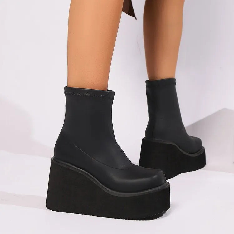 Black women's wedge ankle boots with waterproof platform in extended sizes