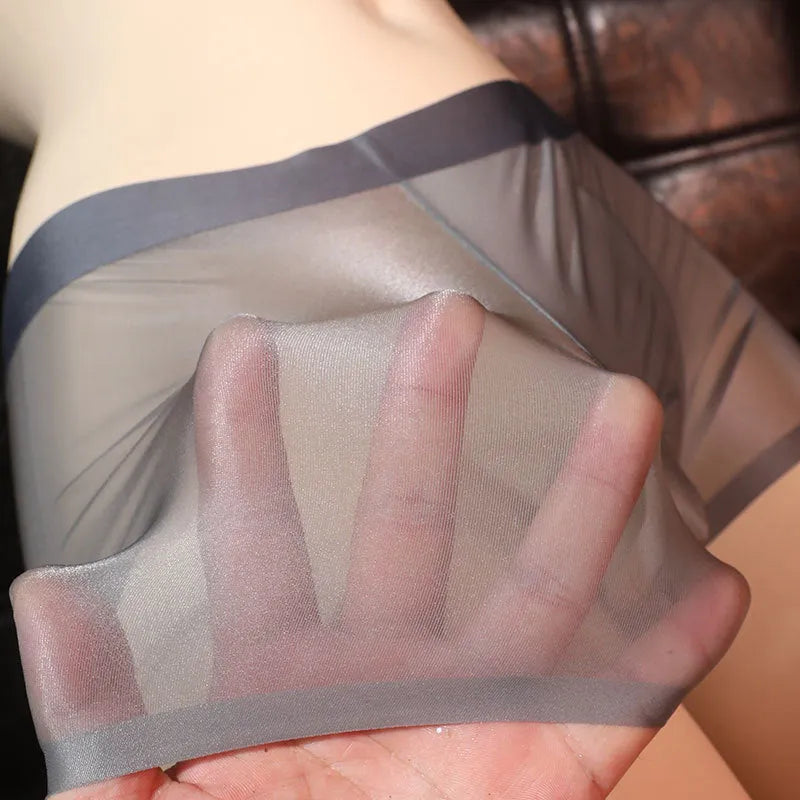Men's ultra-thin light gray nylon boxer underwear laid flat, showing solid colour design.