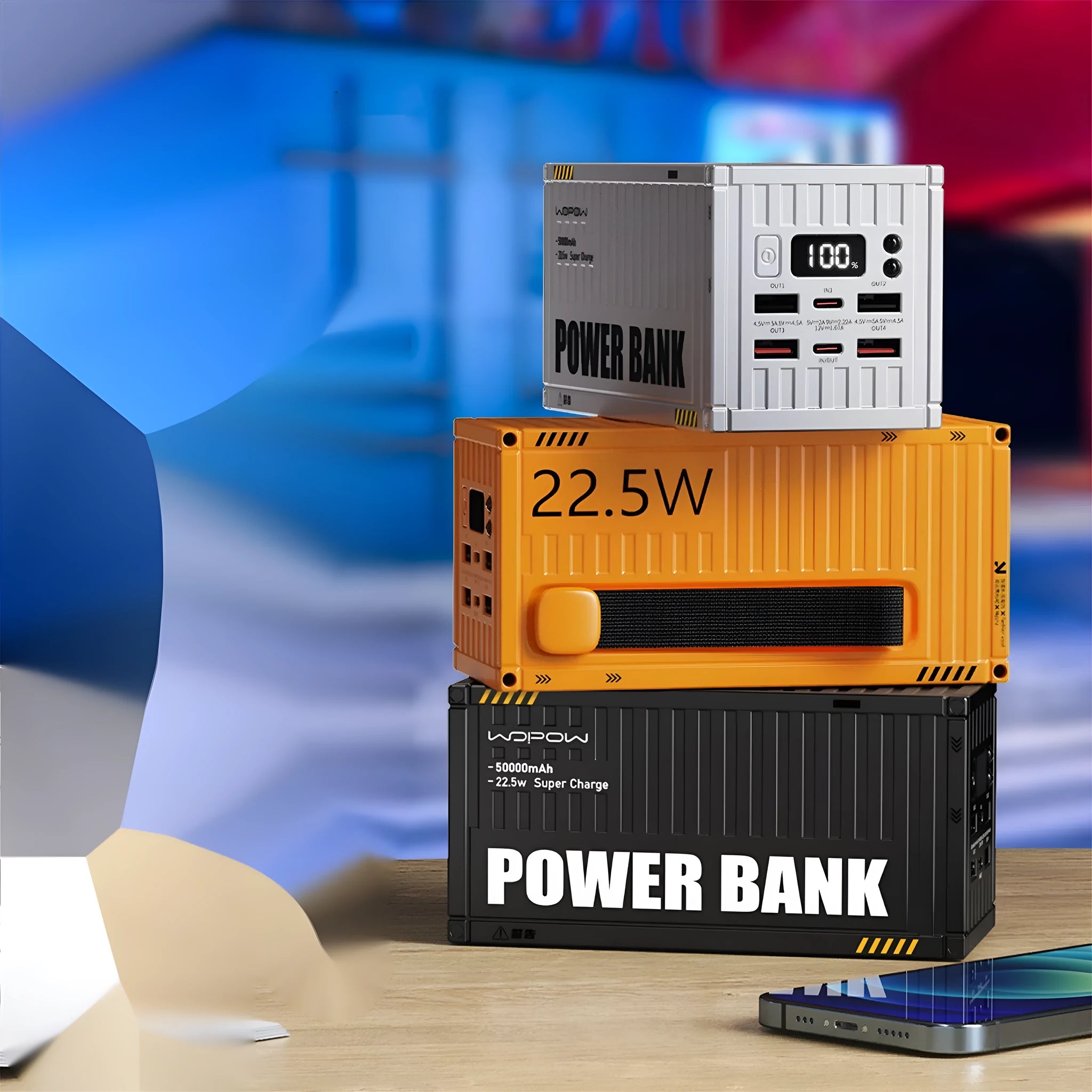 Yellow, black, and silver 50000mAh power bank with digital display showing battery level and five USB output ports.
